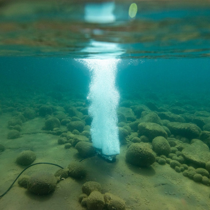 Kasco Robust Aire diffused aeration system producing vertical bubble plume from lake bottom diffuser