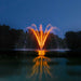 Kasco Stainless Steel LED Light Kit showcasing amber illuminated multi-tier fountain with reflective water surface