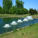 Kasco Surface Aerator - Multiple Aerators on Water with Trees at the Background