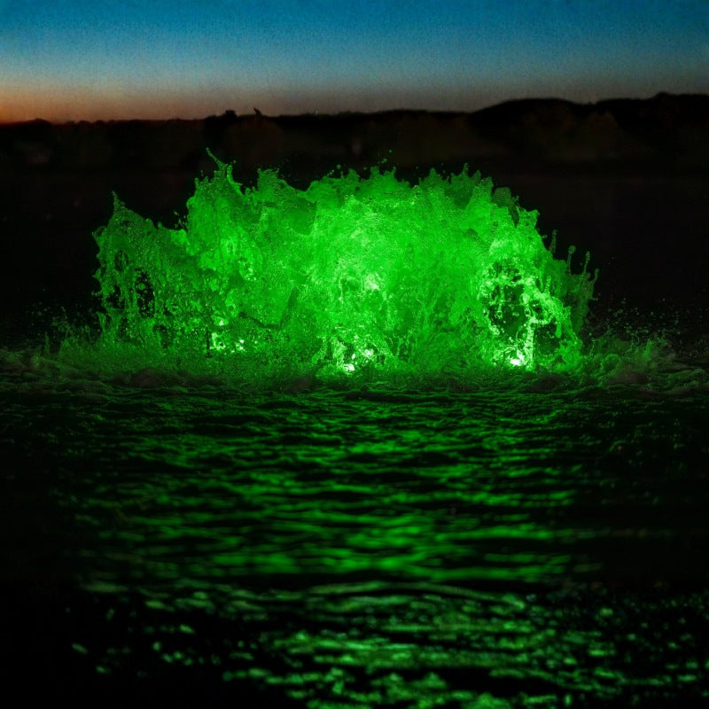 Kasco surface aerator with green LED lighting illuminating pond water