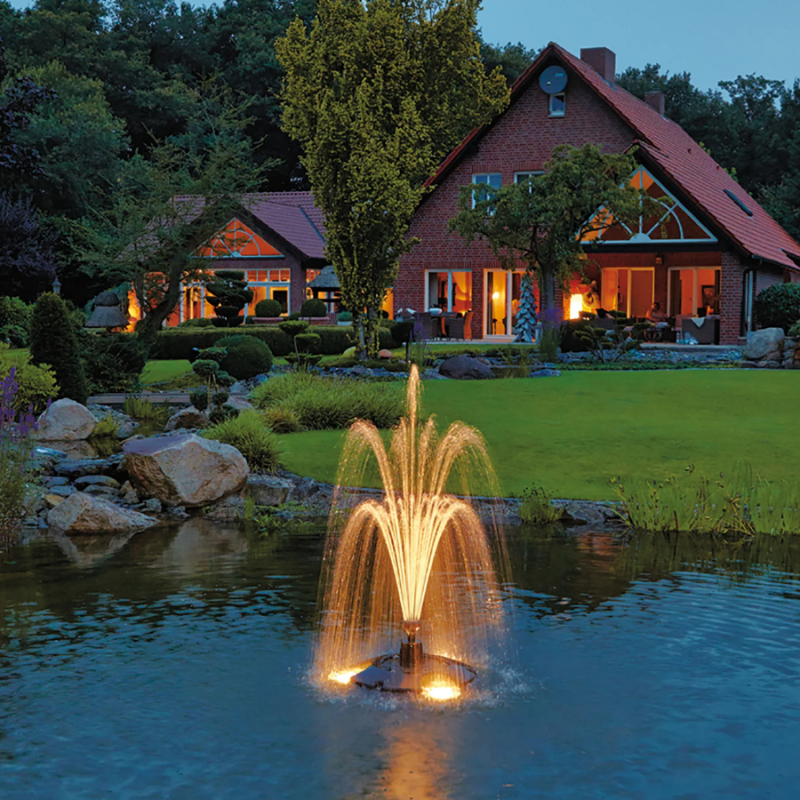 Oase PondJet Floating Fountain - On Water Display with Led Light with House at the Background