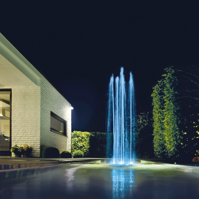 Oase Water Quintet Fountain - On Water Display with Blue Led Light Beside a House