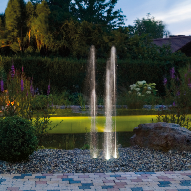 Oase Water Trio Fountain - On Display with Beautiful Garden at the Background