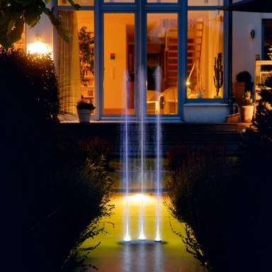 Oase Water Trio Fountain - On Water Display wth Led Light In Front of a House