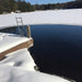 Outdoor Water Solutions De-Icer maintaining a large open-water area beside a snow-covered dock on a frozen lake