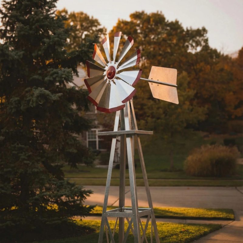 Outdoor Water Solutions Decorative Backyard Windmill with galvanized fan blades, red tips, and metal tail vane