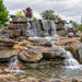 Savio Pond Free Waterfall Packages completed tiered rock waterfall with multiple cascading drops, natural stones, and pebble landscaping