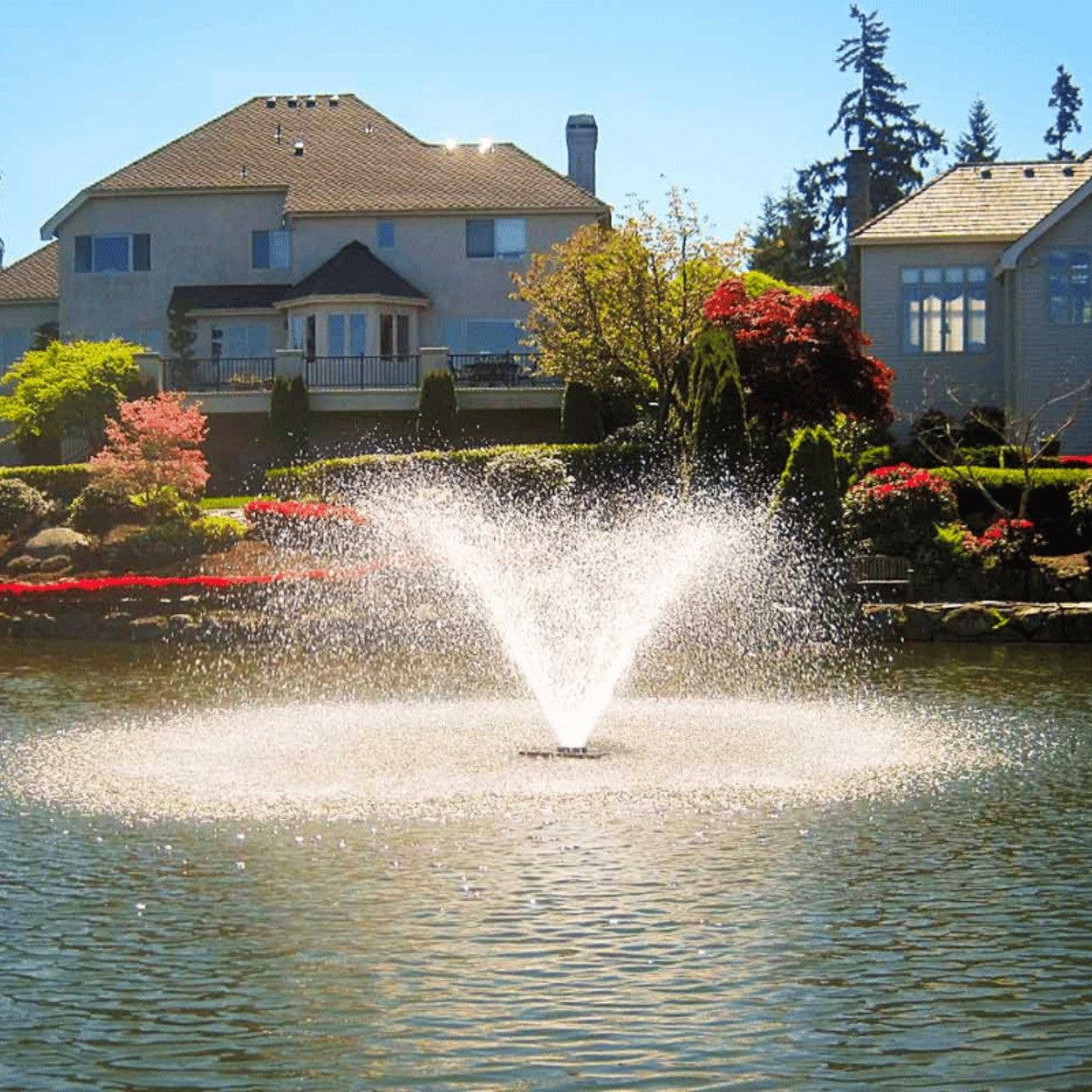 Scott Aerator DA-20 Aerating Fountain Masterpiece Bundle - DA-20 Fountain On Water with Houses at the Background