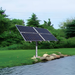 Scott Aerator Solar Boilermaker Aerator - 4 Solar Panels on Grass Beside the Pond