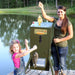 Texas Hunter Fish Feeder - A young girl and her mom caught a fish, with the feeder right beside them