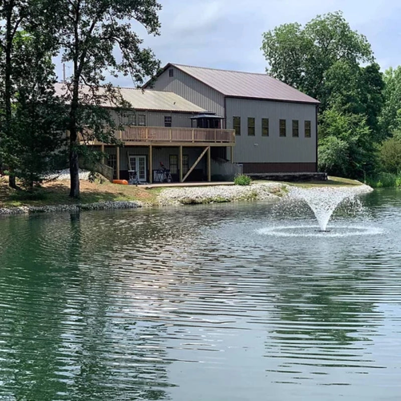 Vanguard Typhoon 3/4 HP Floating Display Aerator On Water Display with House at the Background