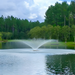 Vertex FunnelJet Floating Fountain Series - On Water with Trees at the Background