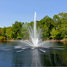 Vertex TriTier Floating Fountain Series On Water with Trees at the Background
