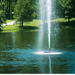 SCOTT AERATOR Gusher Fountain - On Water Display with Trees at the Background